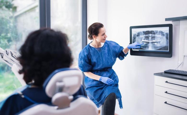 Dentist explaining x-ray to patient