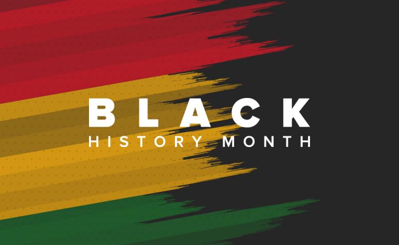 The words "Black History Month" written in white text on a black background with brushstrokes of the Pan-African colours of red, yellow, and green.