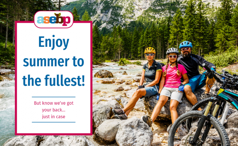 Portrait of happy family cycling together, taking a break by a mountain stream